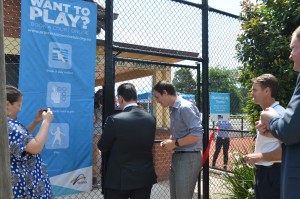 PHTC President Peter Mattessi helps Sports Minister John Eren punch in his gate code.